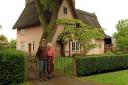 The late Keith Bullock and wife Ann in front of Church Farm House at Cotton