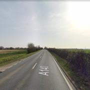 The A140 is partially blocked after a three vehicle crash