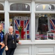 Vanessa Holden (right) and members of staff at Cancer Research UK put together a window display commemorating Queen Elizabeth II.