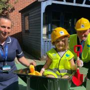Children's department sister Faye Button with six-year-old Scarlett and chief executive Nick Hulme