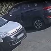 Police are looking for the driver of the black car in this photo in the hope that they can assist with the investigation