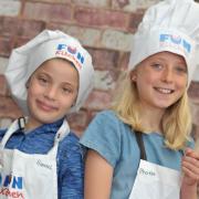 Hannah and Phoebe have a go at cooking  Picture: SARAH LUCY BROWN