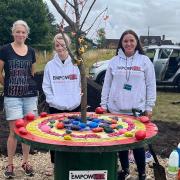 Three young girls from the Ipswich area have completed their project to create a Covid memorial garden. The project was run by Ipswich charity, Autism & ADHD. Second right: Michelle Chisholm.