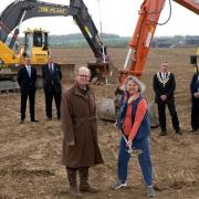 Mid Suffolk Council leader Suzie Morley breaks the ground for the Gateway 14 project in April alongside project chair Sir Christopher Haworth